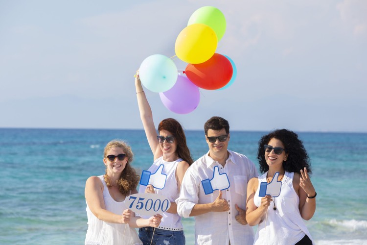 The Lefkada-Rentals team celebrating on the beach
