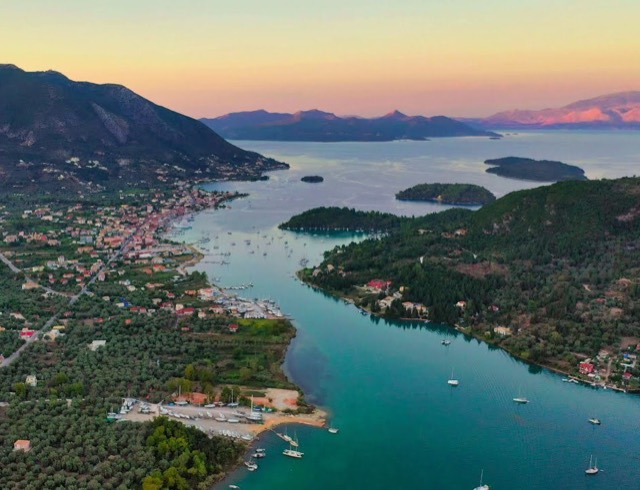 Nidri from above at sunset, with the islets across the bay